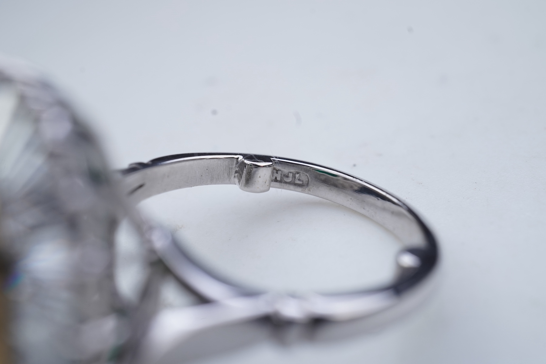 An emerald and diamond ring